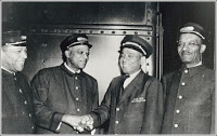 Train porters Shirley Jackson, Pete Stevens, Harry Gairey and Jimmy Downes posing for a photo (undated).